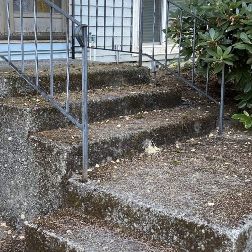 pressure washing brush prairie front steps before